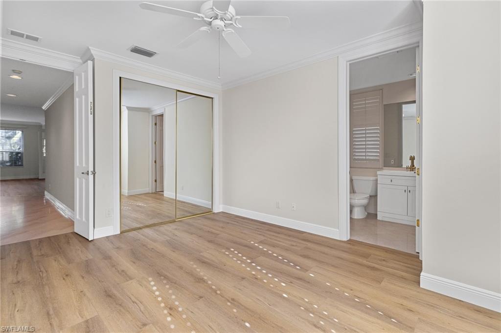 137 Colonade Circle, Unit 601 Naples, FL 34103 - Photo 20 of 28 a view of a room with a hardwood floor and a bathroom