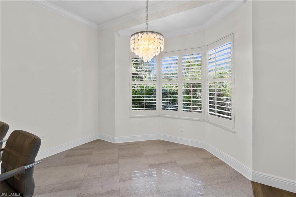 137 Colonade Circle, Unit 601 Naples, FL 34103 - Photo 9 of 28 a view of a livingroom with windows