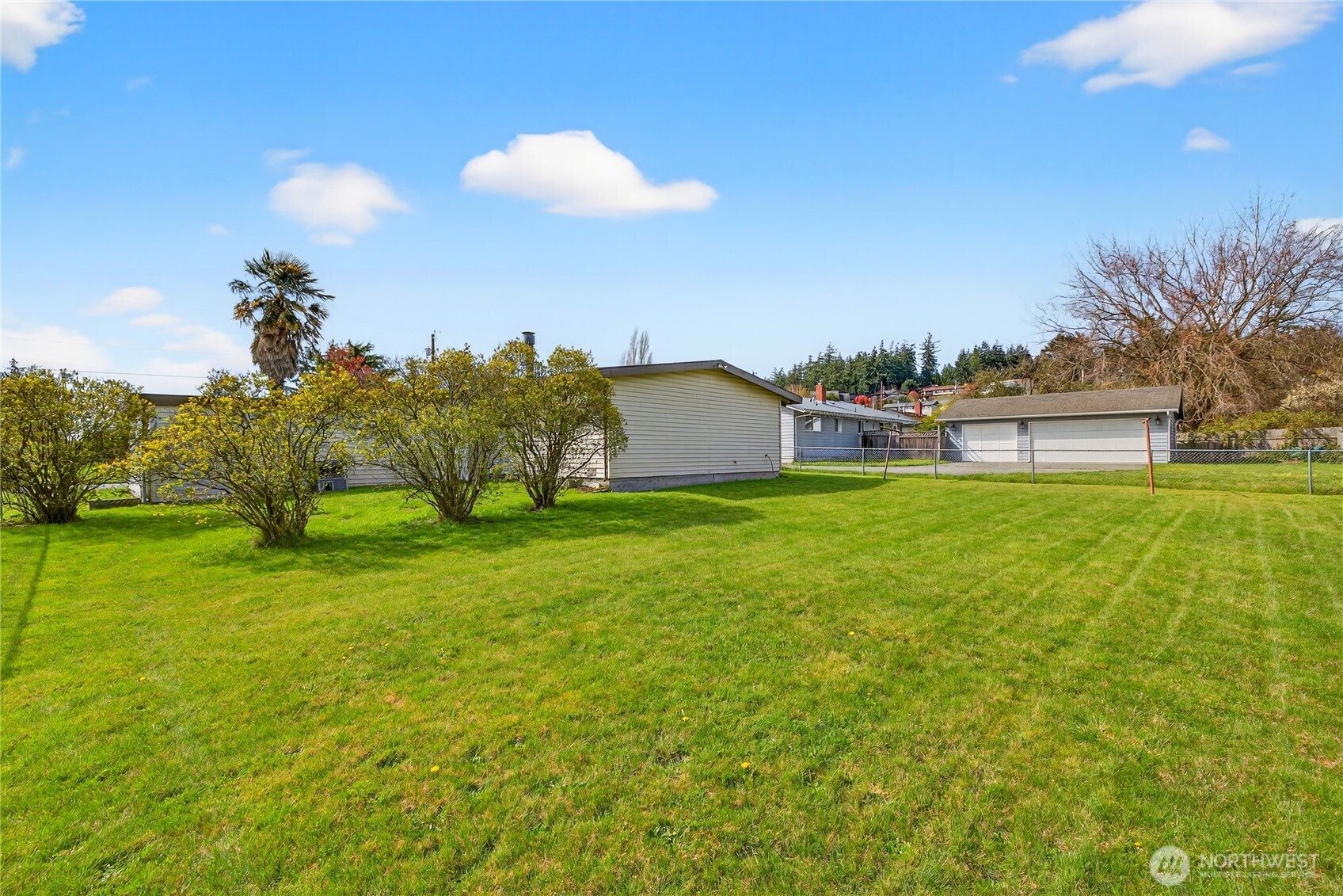 282 Southwest 10th Avenue Oak Harbor, WA 98277 - Photo 27 of 33 a swimming pool with wooden fence