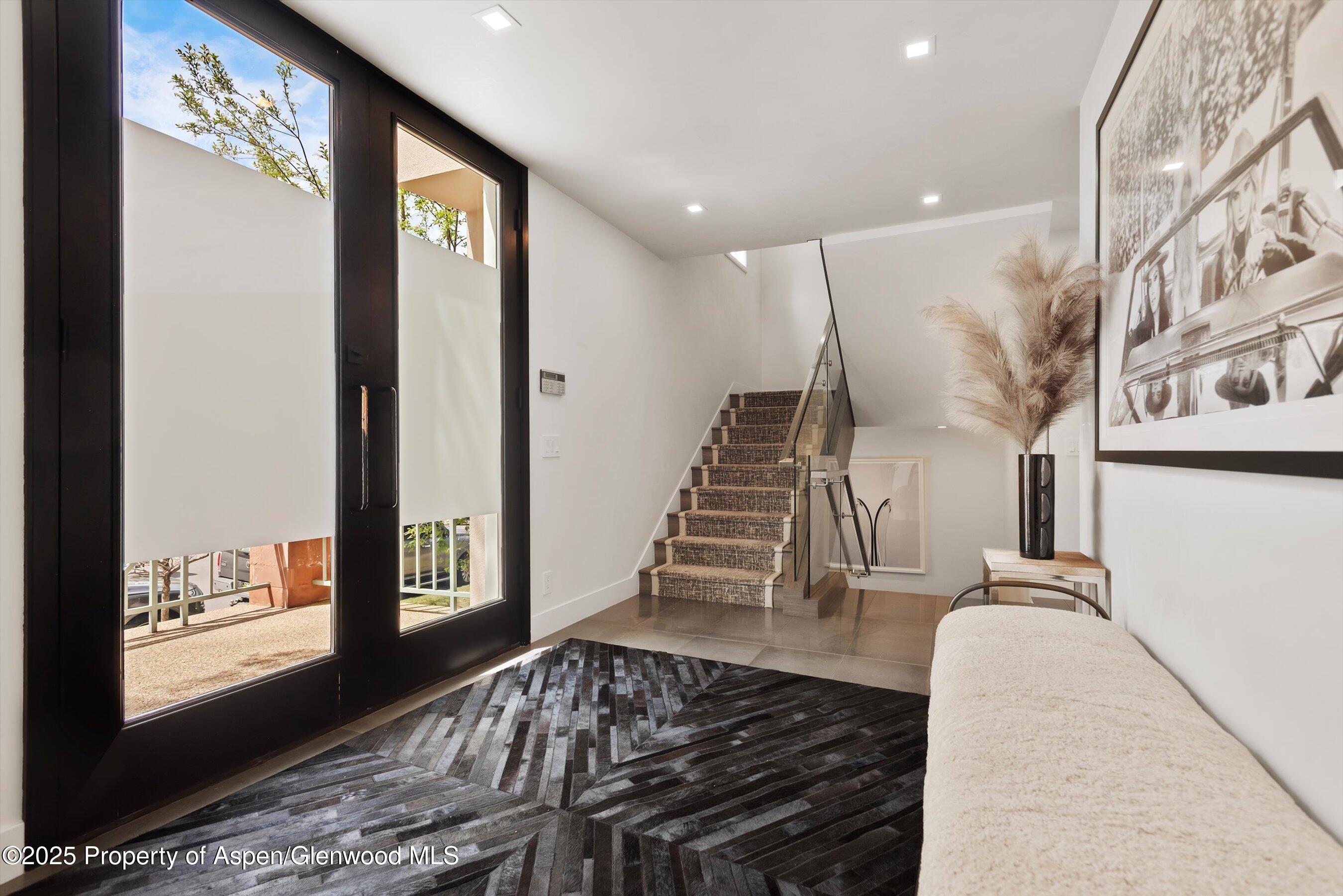 120 South Spring Street, Unit 1 Aspen, CO 81611 - Photo 14 of 37 a view of entryway and hall with wooden floor