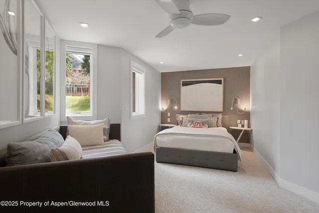 a bedroom with bed and window