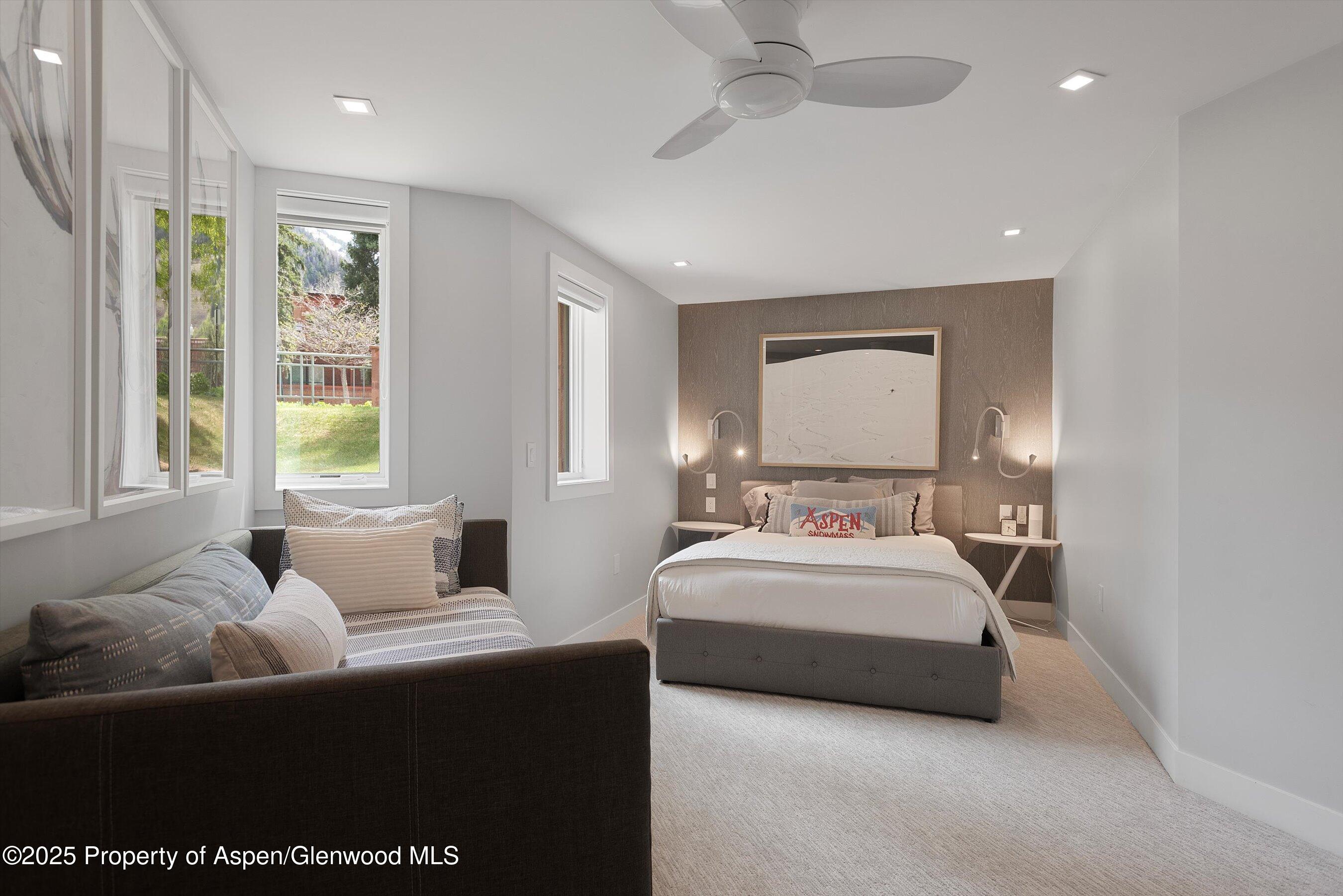 120 South Spring Street, Unit 1 Aspen, CO 81611 - Photo 25 of 37 a bedroom with bed and window