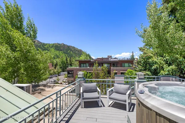 a view of a roof deck with couches