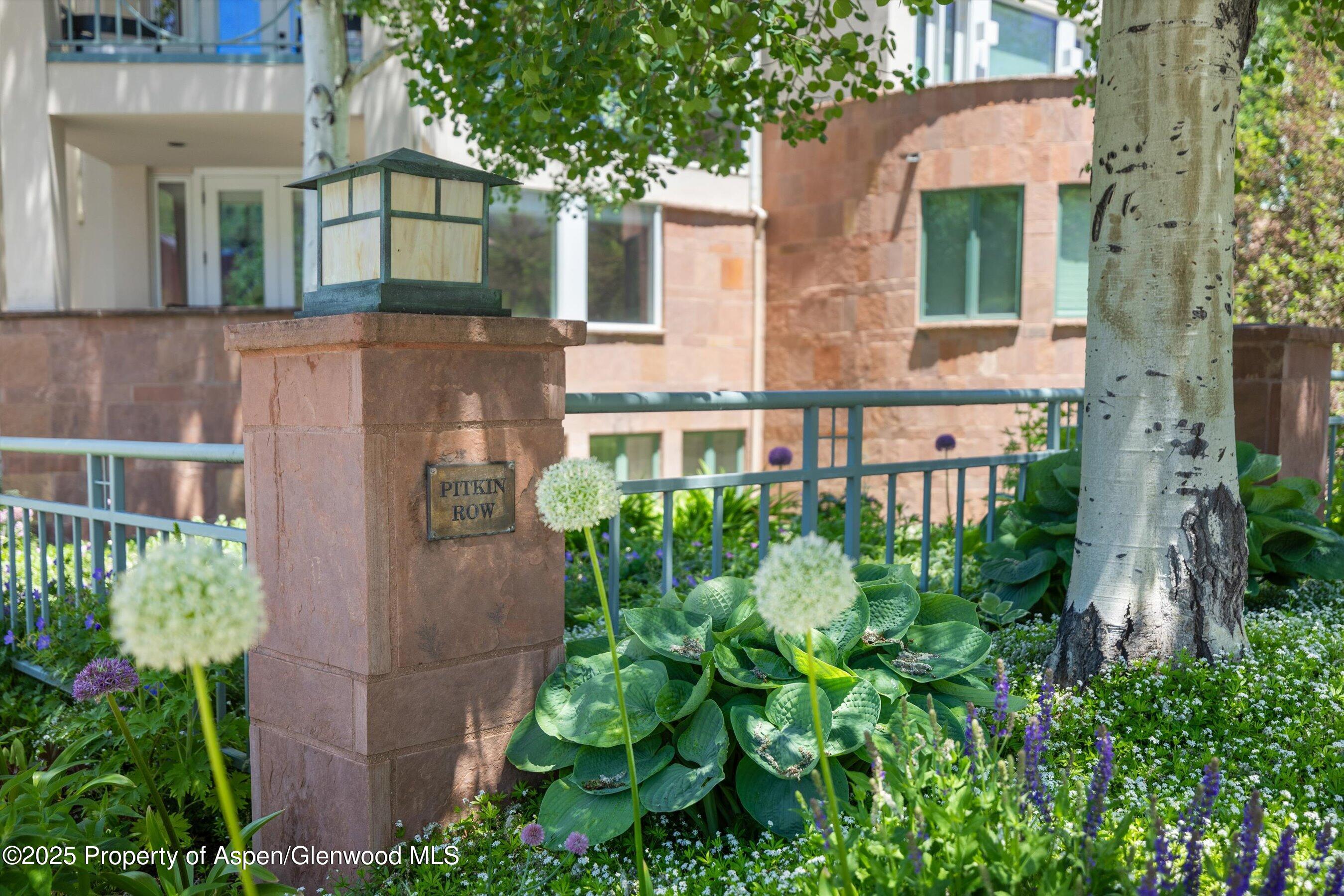 120 South Spring Street, Unit 1 Aspen, CO 81611 - Photo 34 of 37 a front view of a house with a yard