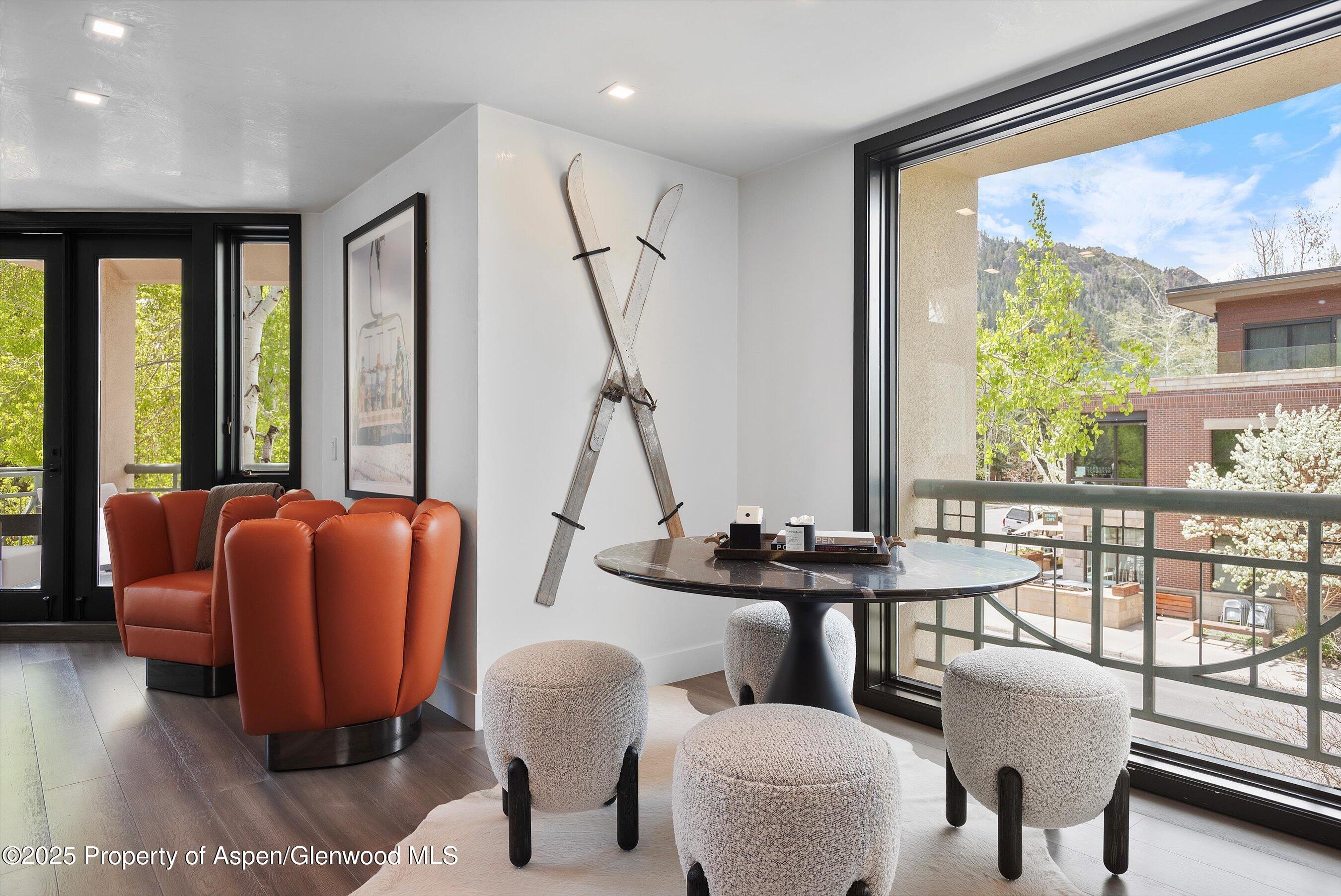120 South Spring Street, Unit 1 Aspen, CO 81611 - Photo 4 of 37 a dining room with furniture and a large window