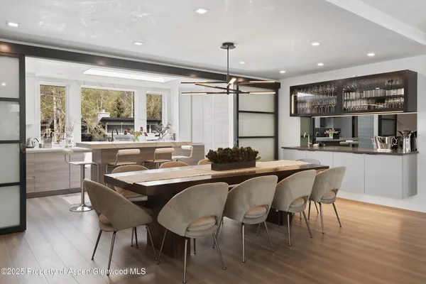 a dining area with furniture and window