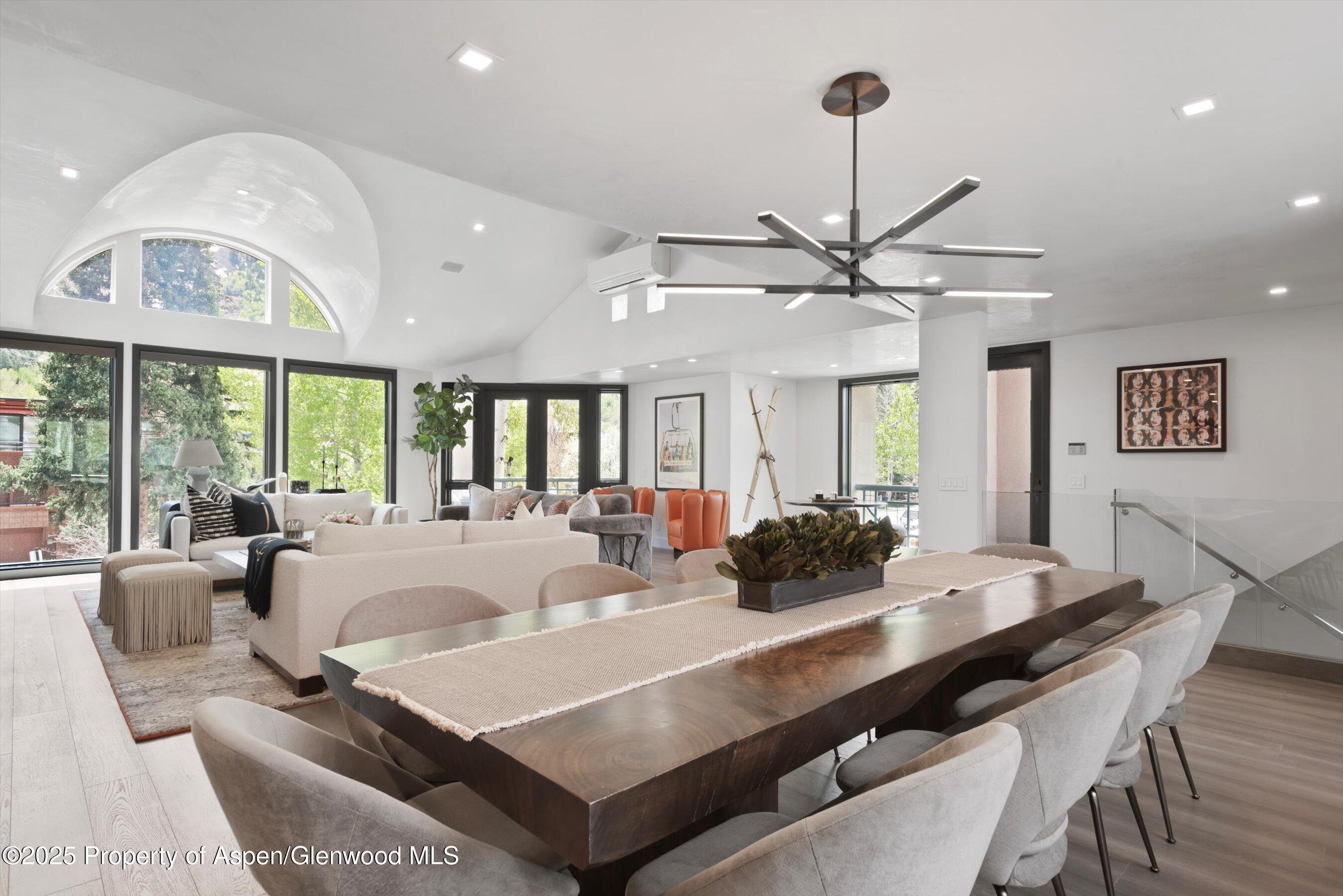 120 South Spring Street, Unit 1 Aspen, CO 81611 - Photo 8 of 37 a view of a dining room with furniture window and wooden floor
