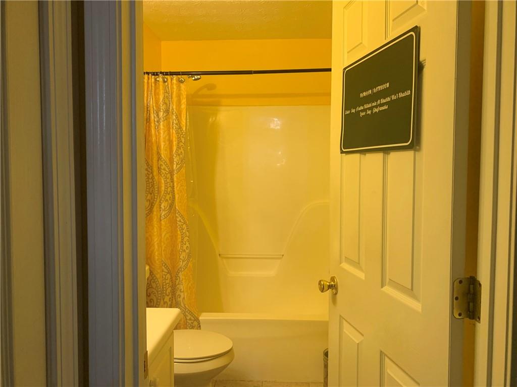 200 Syracuse Lane Covington, GA 30016 - Photo 18 of 22 a bathroom with a shower and a sink