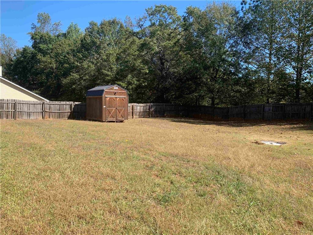 200 Syracuse Lane Covington, GA 30016 - Photo 20 of 22 a view of a terrace with a bench