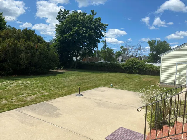 a view of a lake with a yard