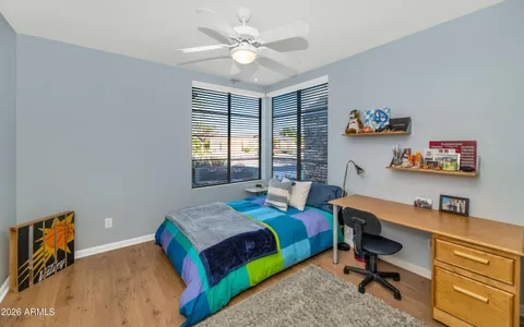 a bedroom with bed and a window