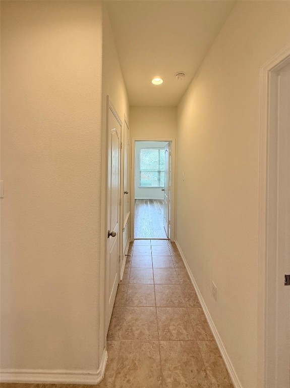 1140 Yellow Iris Road Leander, TX 78641 - Photo 11 of 23 Corridor featuring recessed lighting and light tile patterned flooring