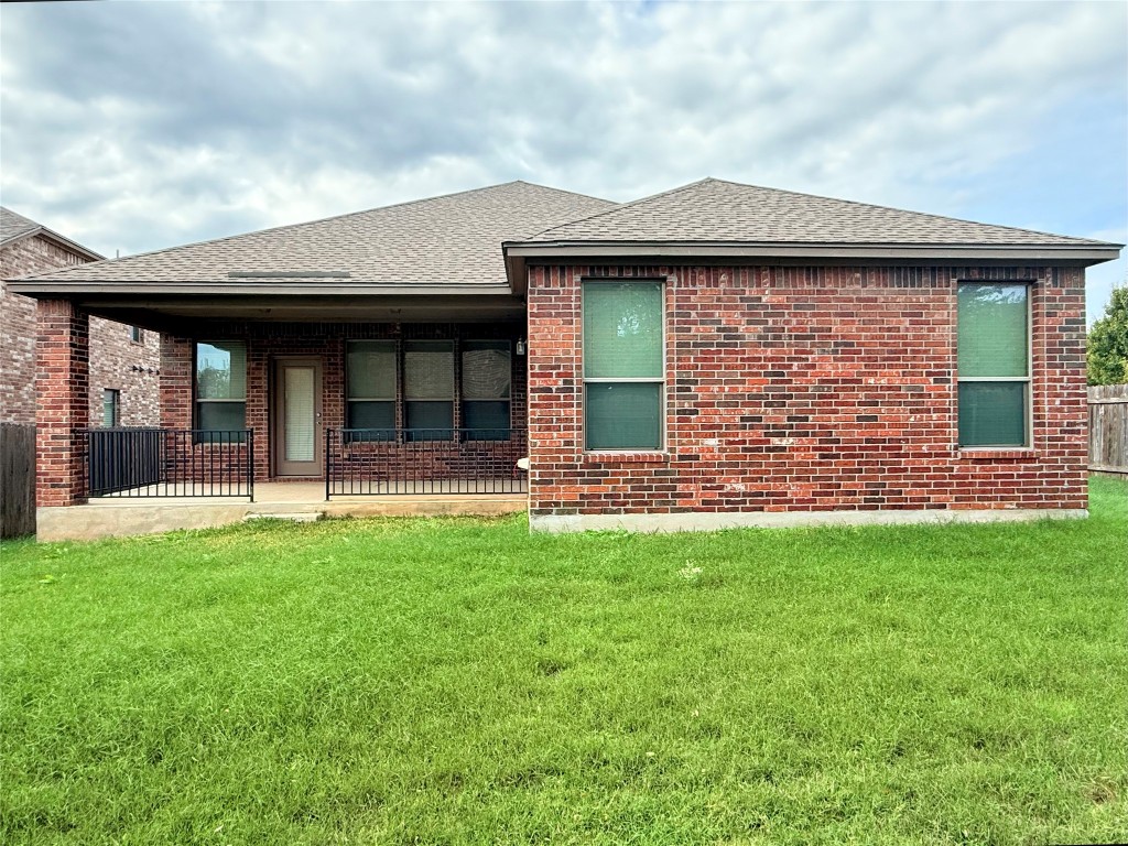 1140 Yellow Iris Road Leander, TX 78641 - Photo 5 of 23 Back of property with a patio area, brick siding, and a shingled roof