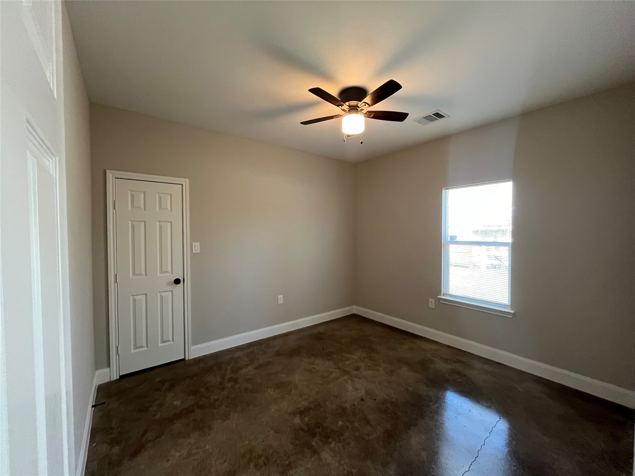 30023 Rosebud Street Magnolia, TX 77354 - Photo 11 of 21 a view of empty room with window and ceiling fan