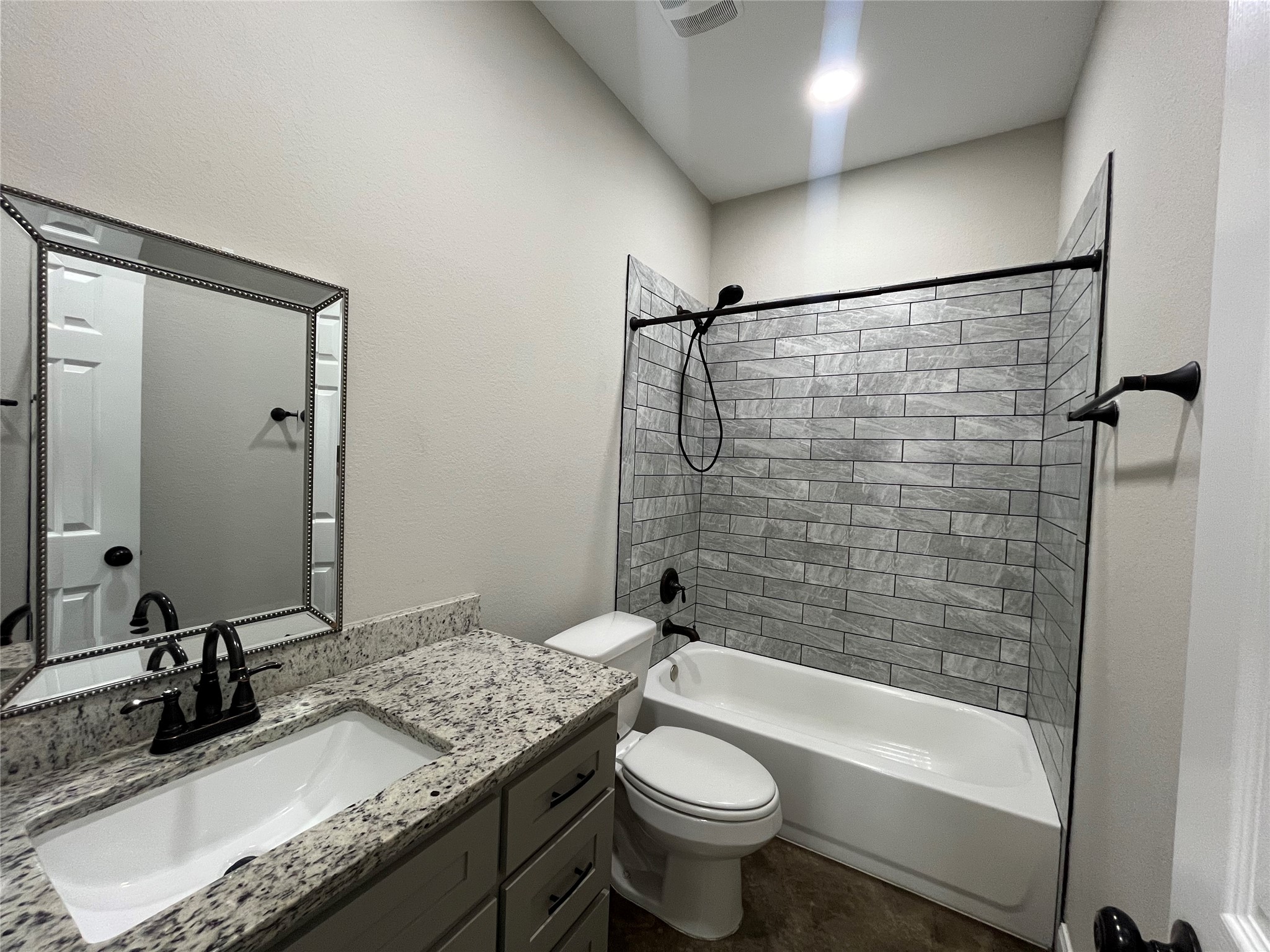 30023 Rosebud Street Magnolia, TX 77354 - Photo 12 of 21 a bathroom with a granite countertop sink toilet mirror and bathtub