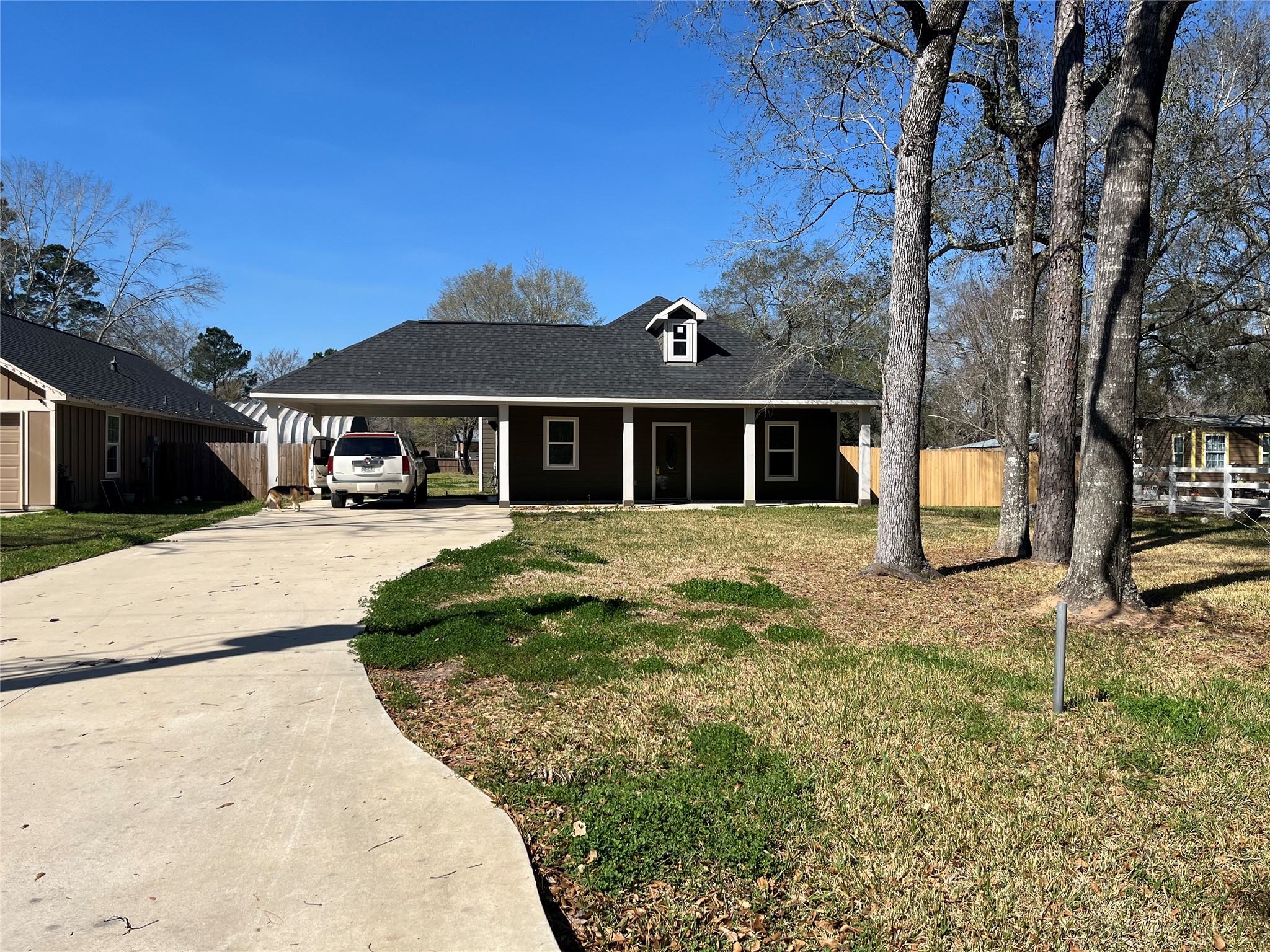 30023 Rosebud Street Magnolia, TX 77354 - Photo 2 of 21 a front view of a house with a yard