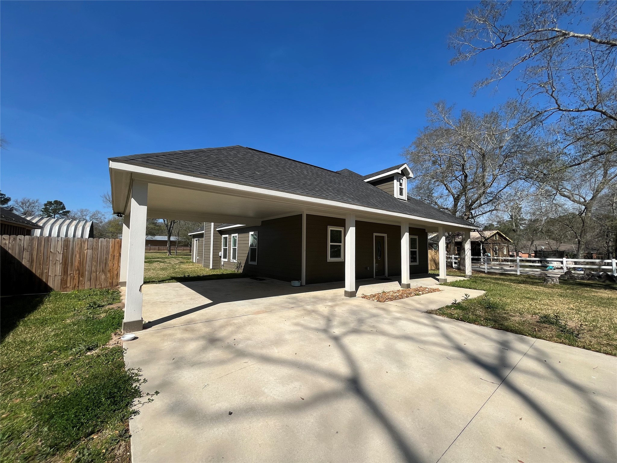 30023 Rosebud Street Magnolia, TX 77354 - Photo 4 of 21 a front view of a house with a yard