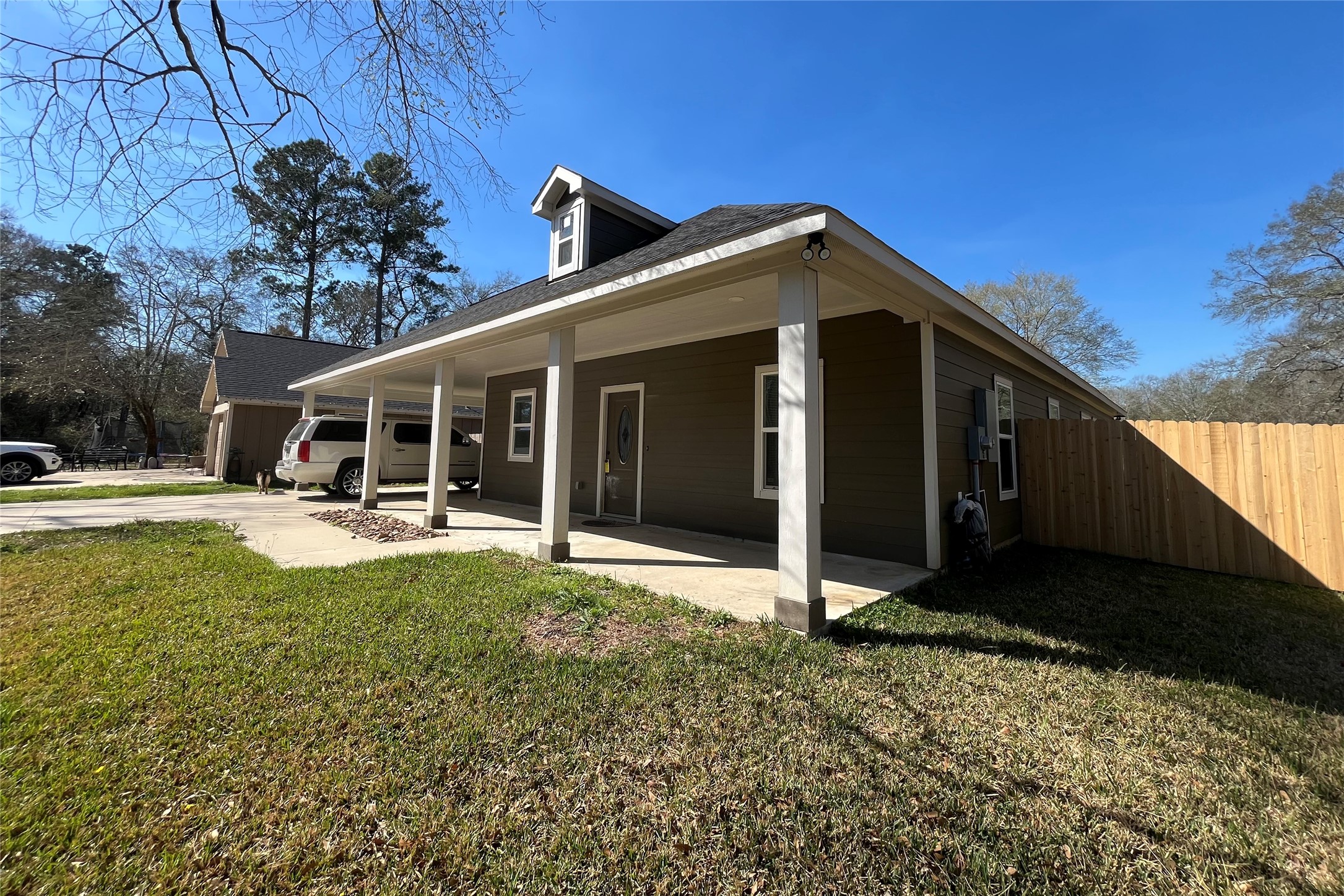 30023 Rosebud Street Magnolia, TX 77354 - Photo 5 of 21 a view of a house with backyard porch and sitting area