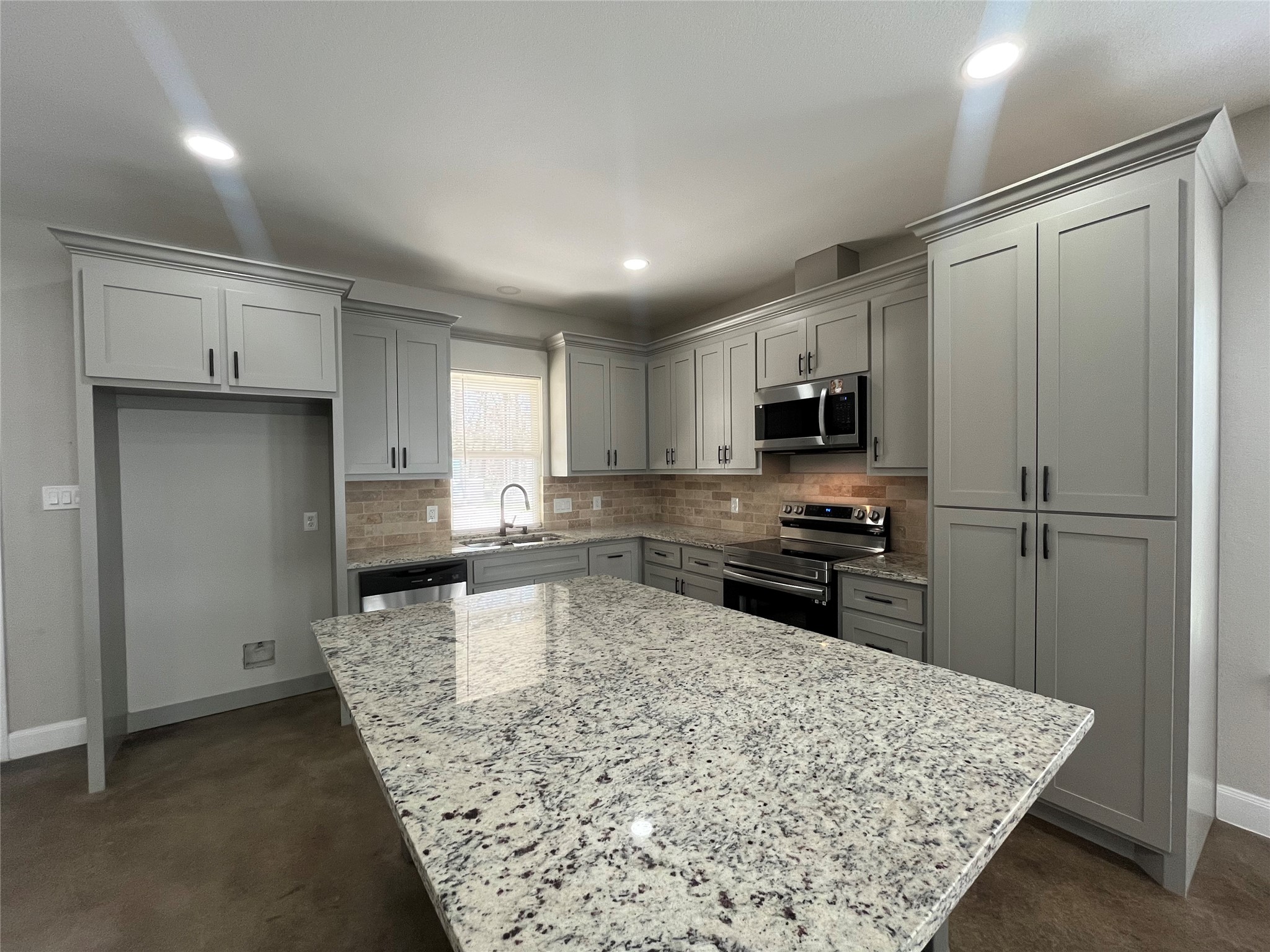 30023 Rosebud Street Magnolia, TX 77354 - Photo 8 of 21 a kitchen with stainless steel appliances granite countertop a refrigerator sink and stove