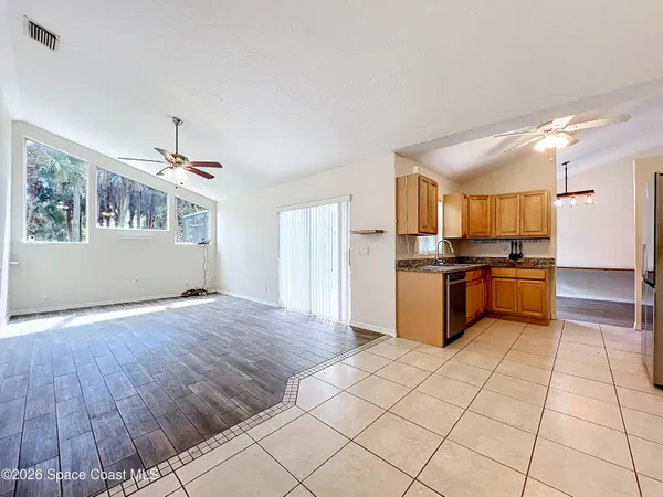 a kitchen with granite countertop a stove and cabinets