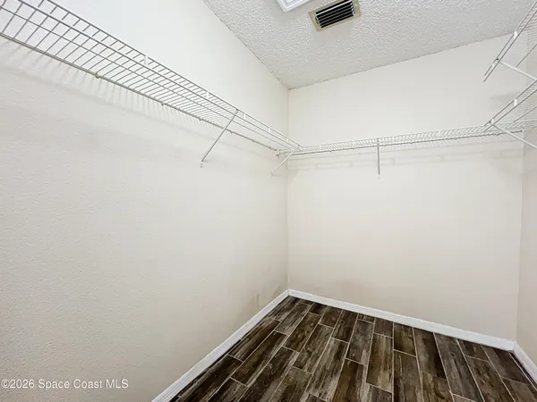 a view of a room with racks on the wall