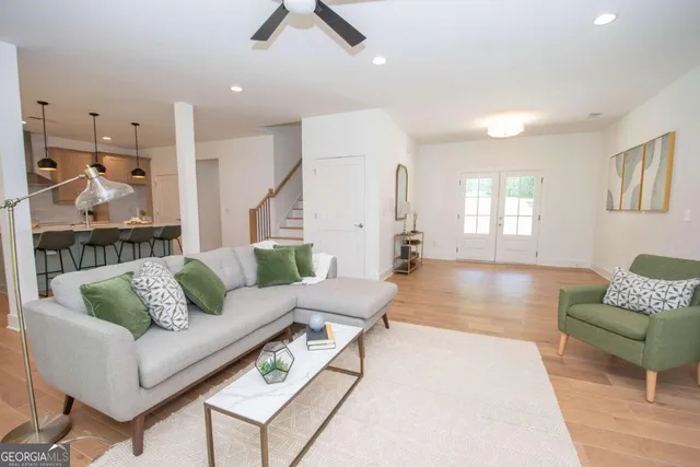 a living room with furniture and a large window