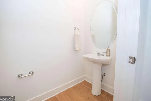 a bathroom with a sink and mirror