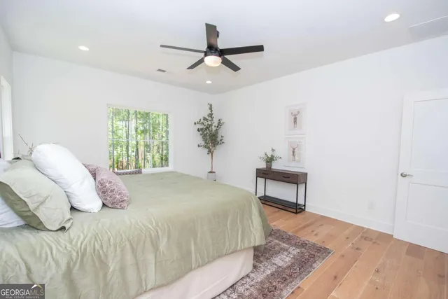 a bedroom with a bed and a table