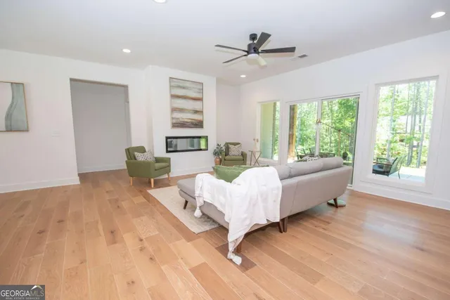 a living room with furniture and windows