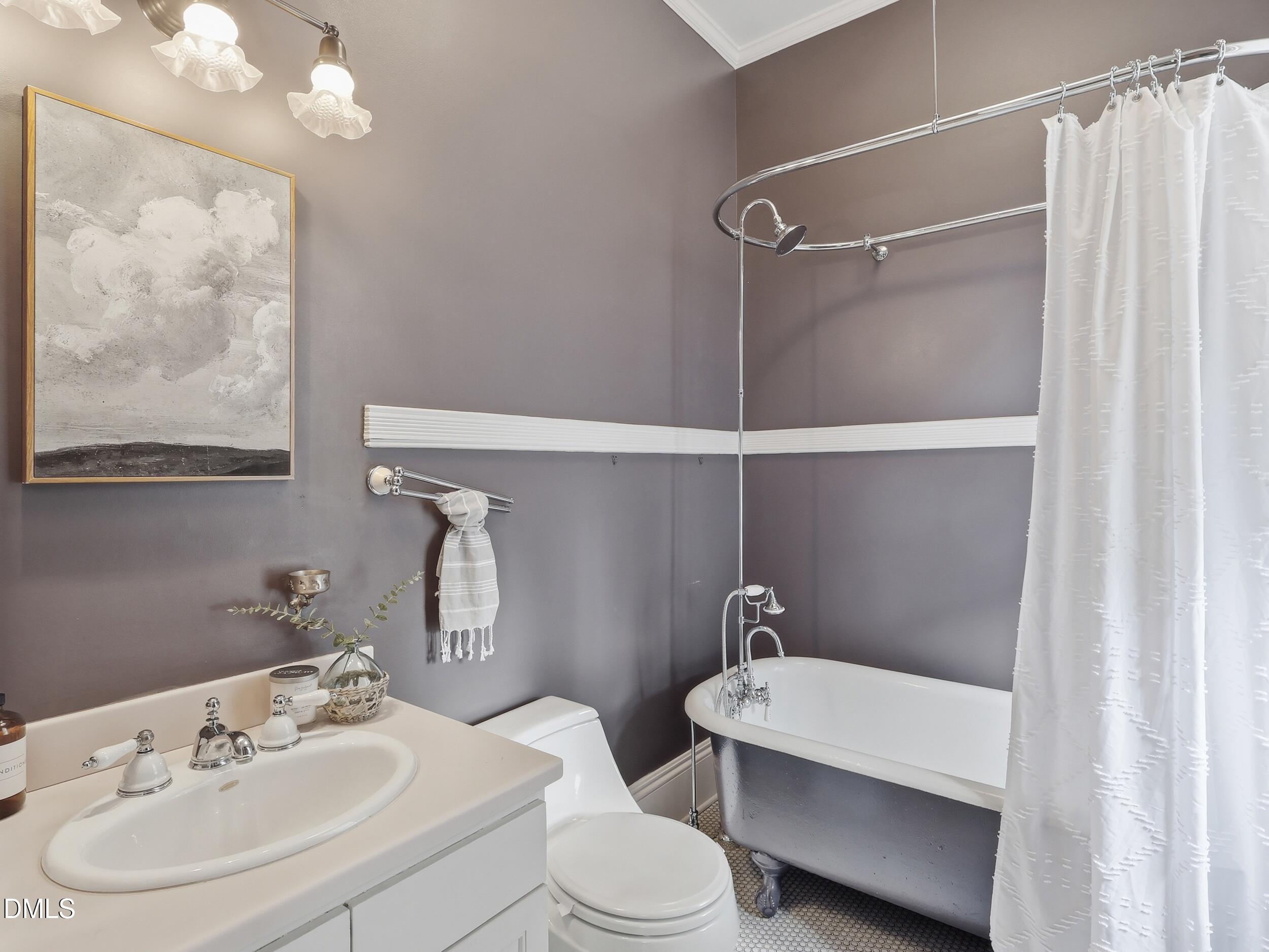 127 Forest Road Raleigh, NC 27605 - Photo 54 of 75 a bathroom with a sink mirror and toilet