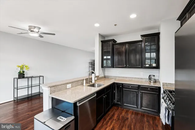 a kitchen with a sink and a stove top oven