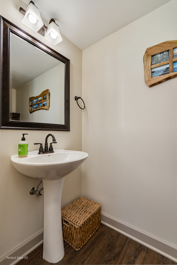 25122 Faraday Road Manhattan, IL 60442 - Photo 8 of 23 a bathroom with a sink and a mirror