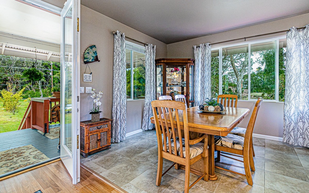 19-4035 Kilauea Road Volcano, HI 96785 - Photo 8 of 27 a view of a dining room with furniture window and wooden floor