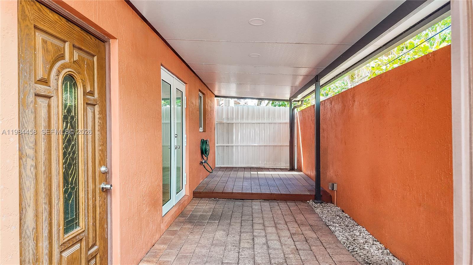 6002 Southwest 8th Street, Unit 3 West Miami, FL 33144 - Photo 4 of 10 a view of a entryway door with wooden floor