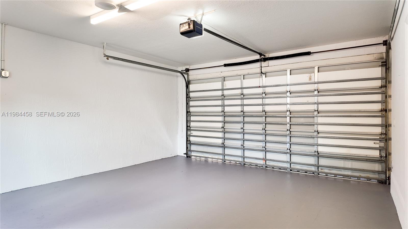 6002 Southwest 8th Street, Unit 3 West Miami, FL 33144 - Photo 5 of 10 a view of a room with racks on the wall