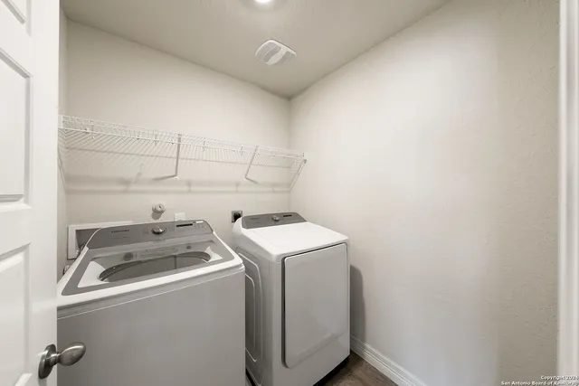 a utility room with dryer and washer