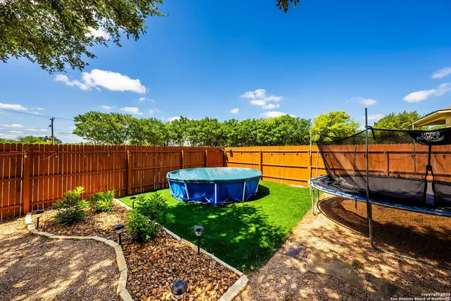 a view of a backyard with sitting area