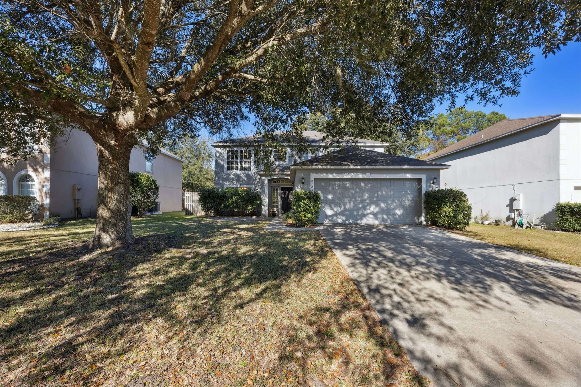 87233 Kipling Drive Yulee, FL 32097 - Photo 1 of 38 a front view of a house with garden