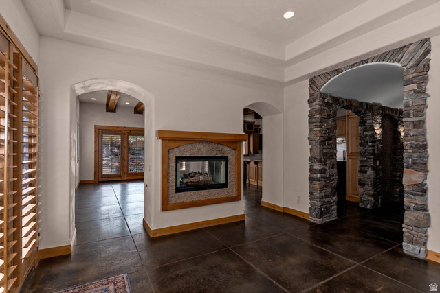 2464 East Granite Way St. George, UT 84790 - Photo 42 of 106 Dining room with hallway to the right that heads to front entry. On the other side of fireplace is a living room and kitchen.
