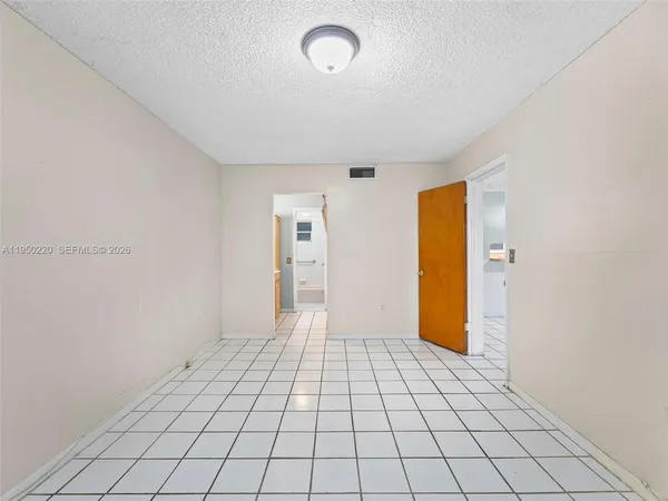 a view of an empty room and window