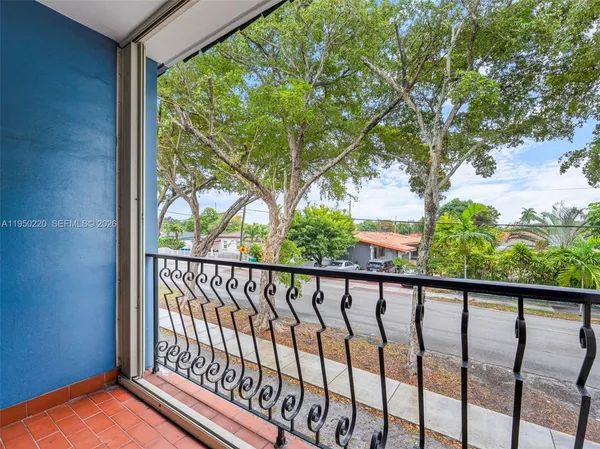 a view of balcony with wooden floor