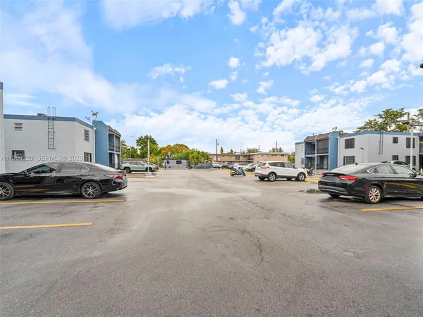 a view of street with parked cars