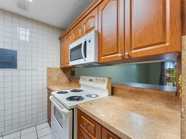 a kitchen with a stove and a microwave