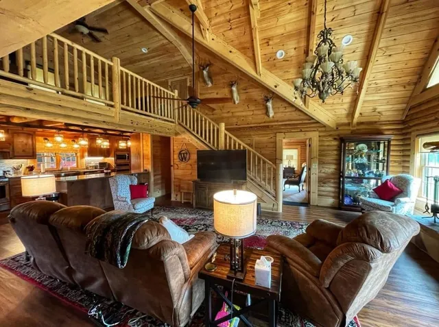 a outdoor living space with furniture and a fireplace