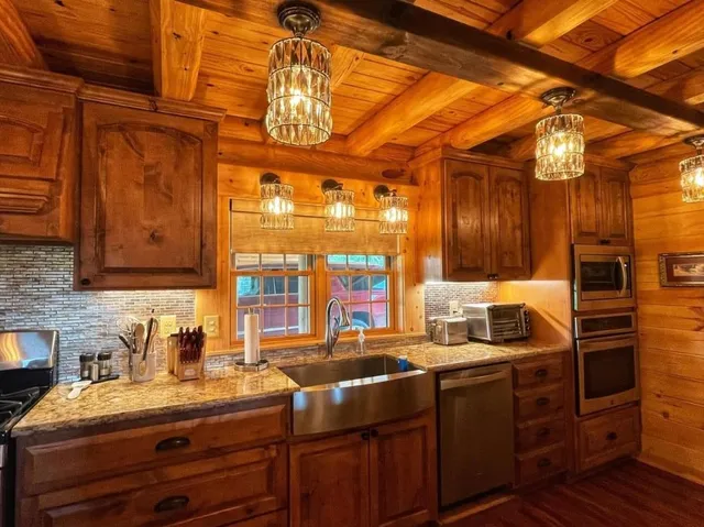 a kitchen with a sink and cabinets