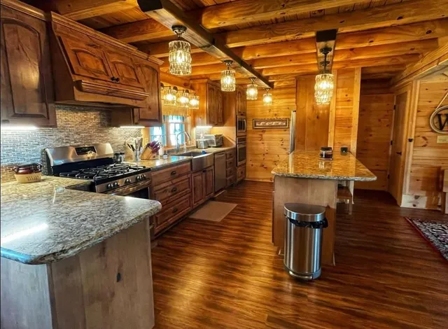 a kitchen with sink and refrigerator