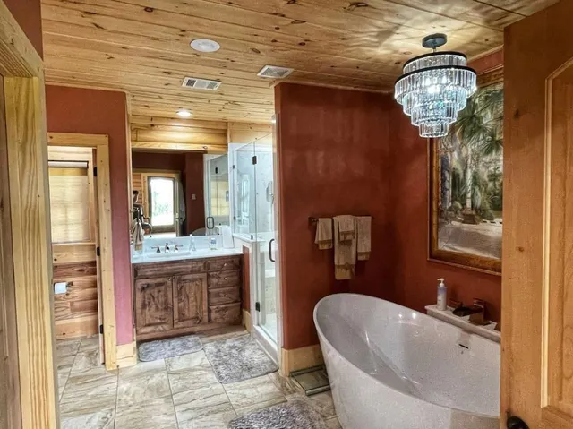 a bathroom with a bathtub and a sink
