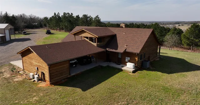 a aerial view of a house with swimming pool