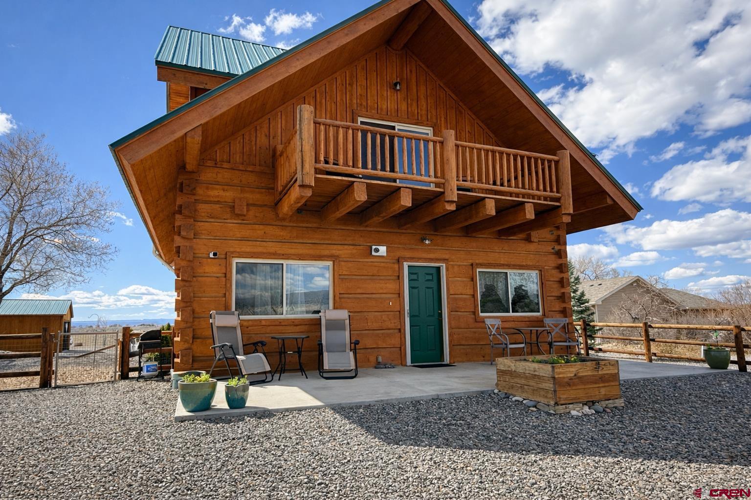 6493 Townsend Road Delta, CO 81416 - Photo 13 of 38 a view of a house with a patio