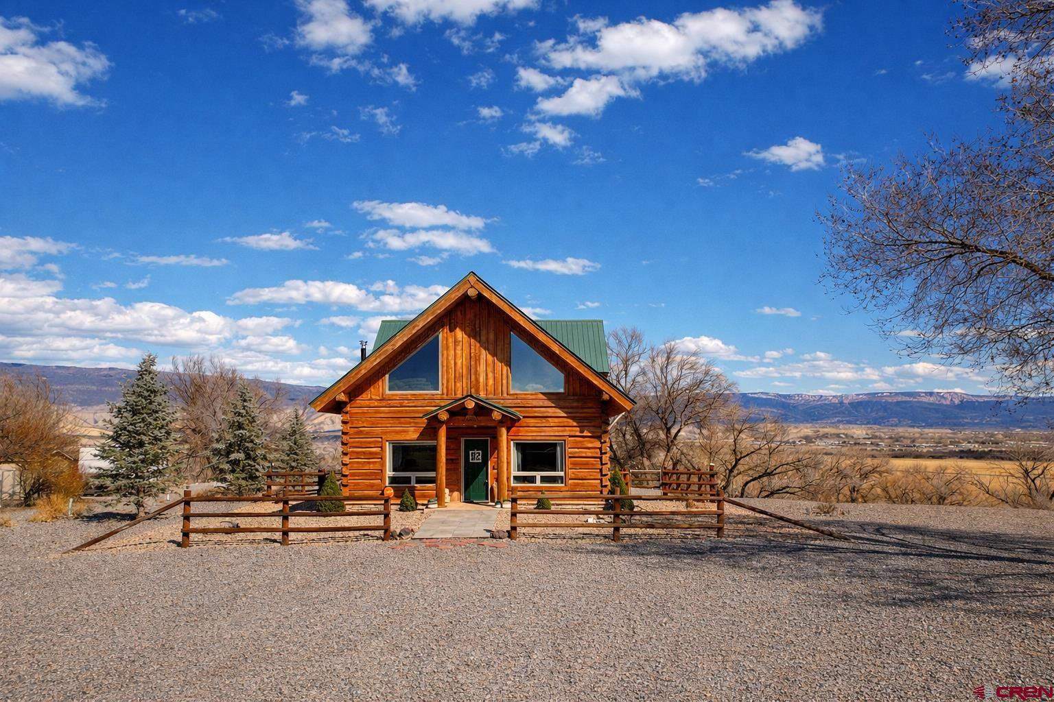 6493 Townsend Road Delta, CO 81416 - Photo 15 of 38 a view of a house with a yard